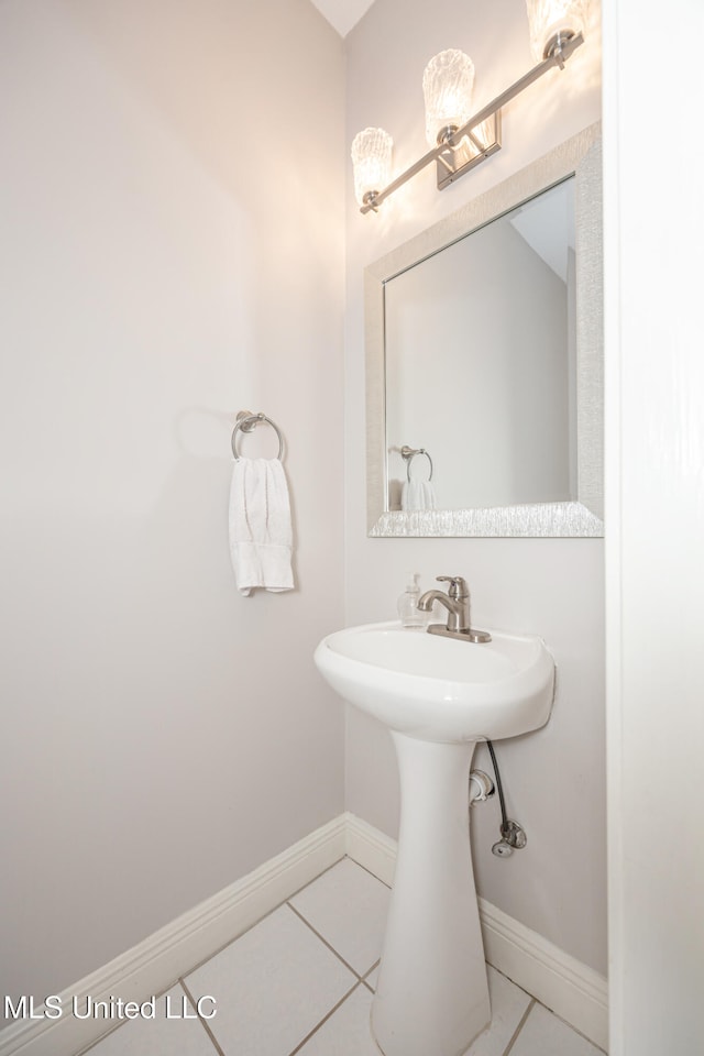 bathroom featuring tile patterned flooring and sink