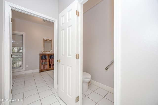 bathroom featuring tile patterned floors and toilet