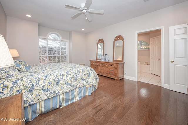 bedroom featuring wood-type flooring, ceiling fan, and ensuite bathroom