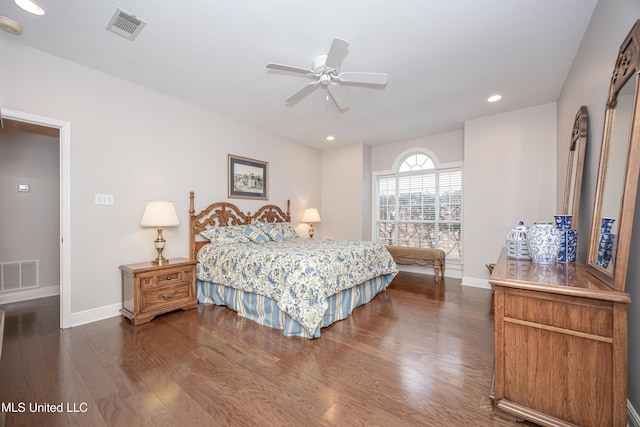 bedroom with ceiling fan and dark hardwood / wood-style floors