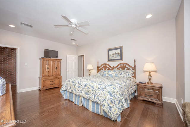 bedroom with dark hardwood / wood-style flooring and ceiling fan