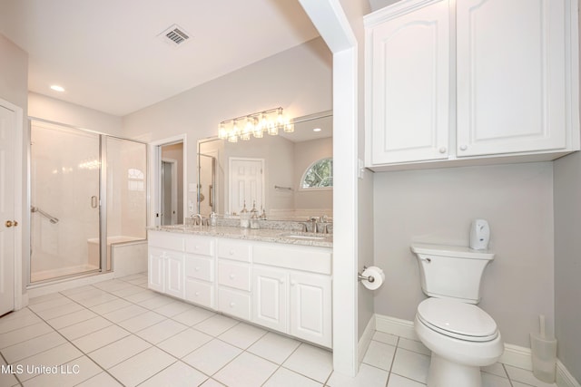 3607 Dijon Ave, Ocean Springs, MS 39564 - bathroom with tile patterned floors, a stall shower, toilet, double vanity, and baseboards