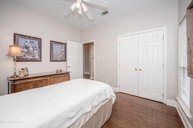 bedroom with ceiling fan, a closet, and dark hardwood / wood-style flooring