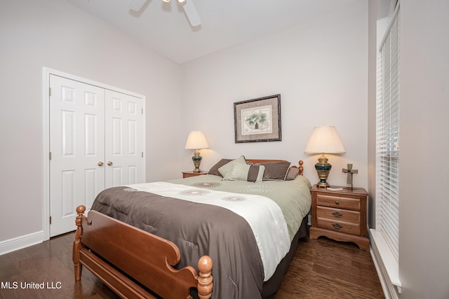 bedroom with dark hardwood / wood-style floors, ceiling fan, and a closet