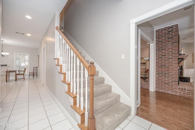 staircase featuring hardwood / wood-style floors