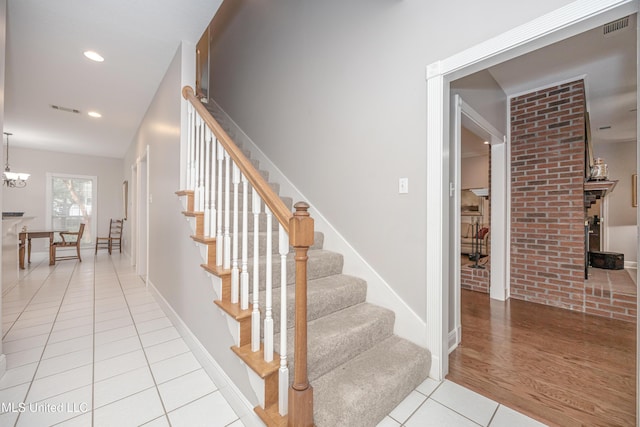 3607 Dijon Ave, Ocean Springs, MS 39564 - stairway with tile patterned floors, recessed lighting, a chandelier, and baseboards