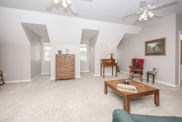 living area featuring lofted ceiling, light carpet, and ceiling fan