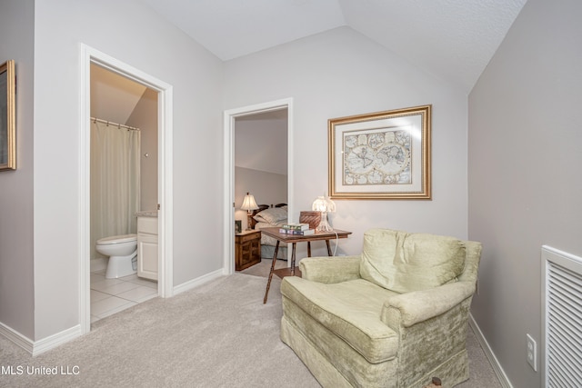 sitting room with light carpet and lofted ceiling