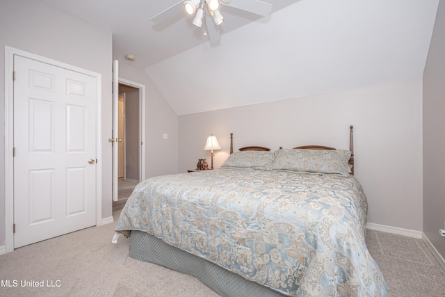 carpeted bedroom featuring lofted ceiling and ceiling fan