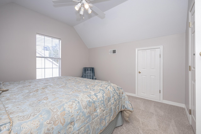 bedroom featuring ceiling fan, lofted ceiling, and light colored carpet