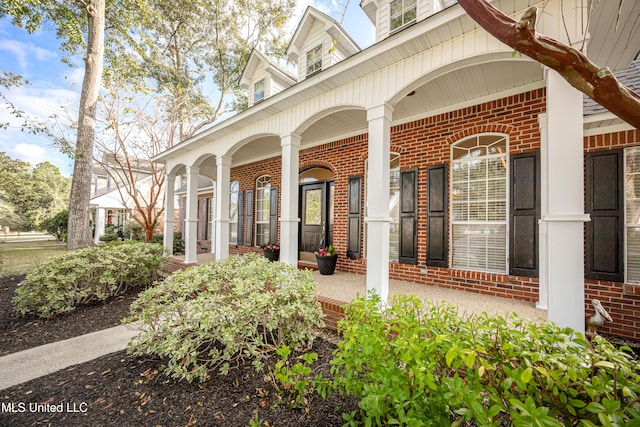 entrance to property with covered porch