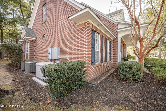 view of side of property featuring central AC