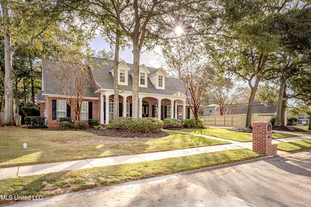 3607 Dijon Ave, Ocean Springs, MS 39564 - cape cod-style house with brick siding and roof with shingles