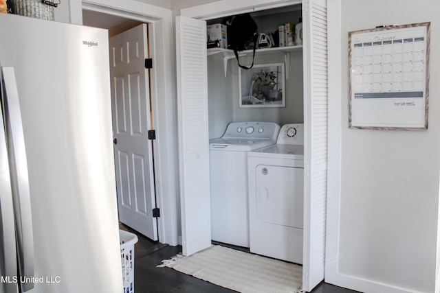 washroom featuring independent washer and dryer and dark hardwood / wood-style floors