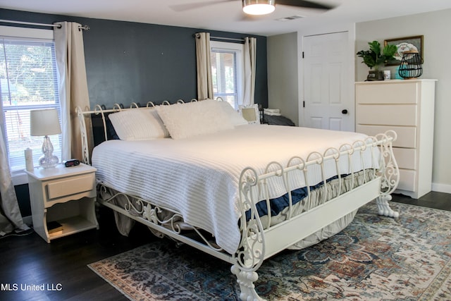 bedroom featuring dark hardwood / wood-style floors and ceiling fan