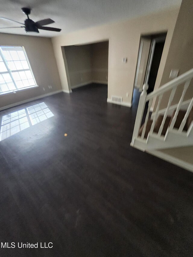 10101 Stephenson Ln, Olive Branch, MS 38654 - unfurnished room with ceiling fan and dark wood-style flooring
