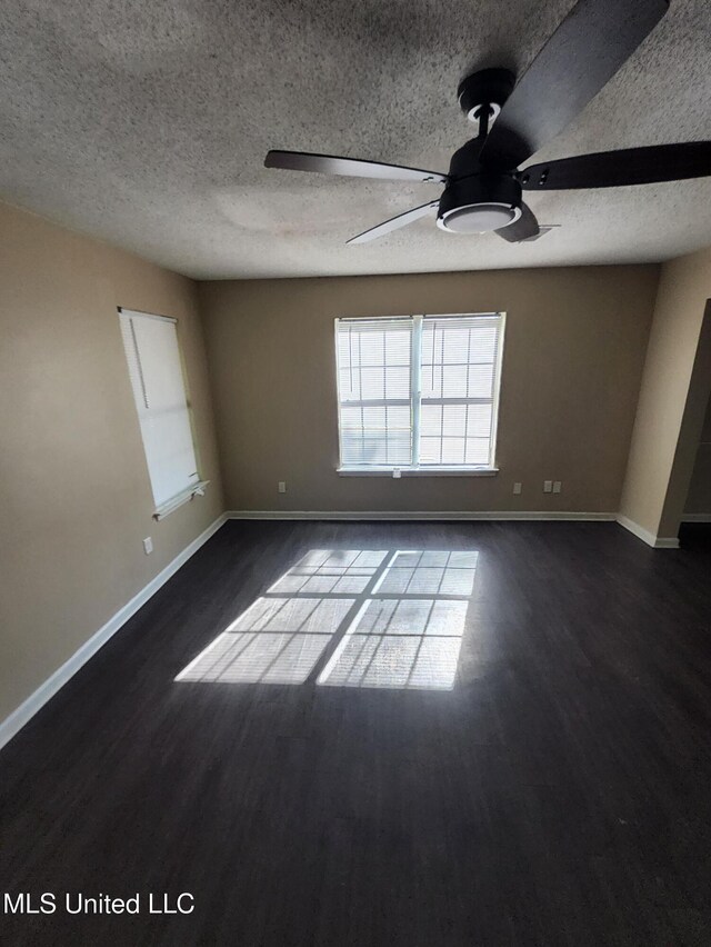 10101 Stephenson Ln, Olive Branch, MS 38654 - unfurnished room featuring a ceiling fan, dark wood finished floors, and a textured ceiling