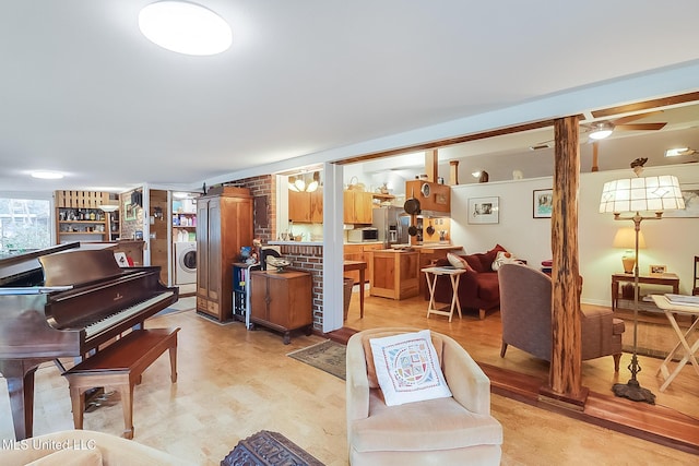 living room featuring washer / clothes dryer and light hardwood / wood-style floors