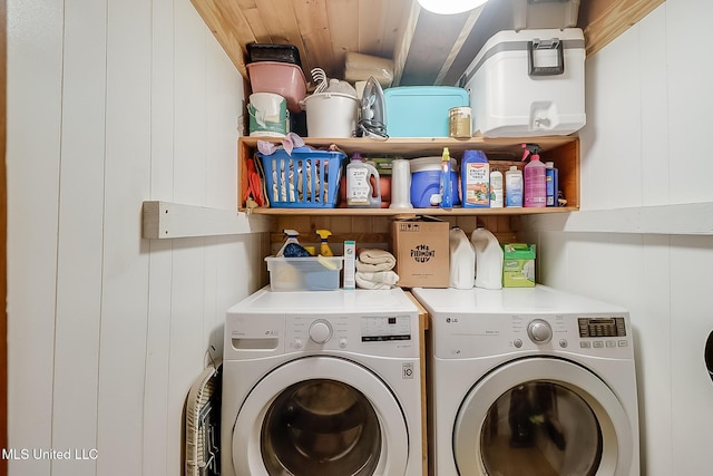 clothes washing area featuring washing machine and clothes dryer and wooden ceiling