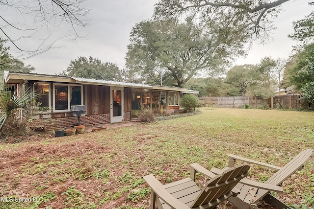 view of yard with a sunroom