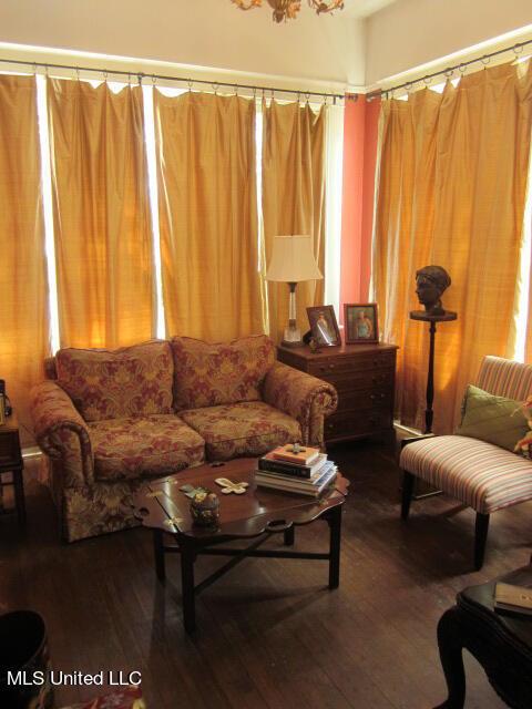 400 Crockett Ave, Greenwood, MS 38930 - living room featuring wood-type flooring and an inviting chandelier