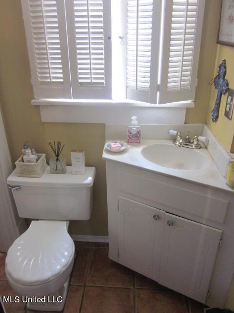 400 Crockett Ave, Greenwood, MS 38930 - bathroom with toilet, tile patterned floors, and vanity