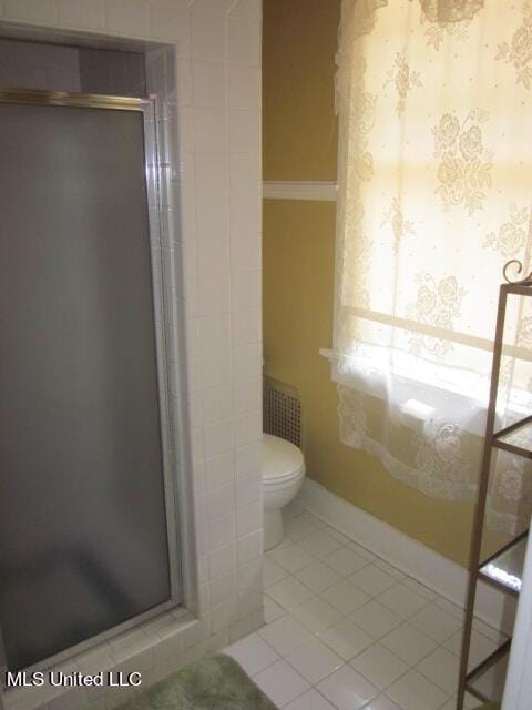 400 Crockett Ave, Greenwood, MS 38930 - bathroom with walk in shower, toilet, and tile patterned floors