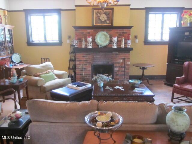 400 Crockett Ave, Greenwood, MS 38930 - living room with a fireplace, plenty of natural light, and wood-type flooring