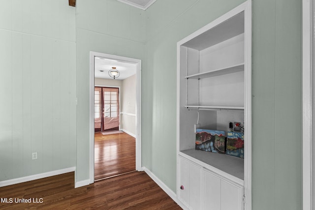 hallway with dark hardwood / wood-style floors