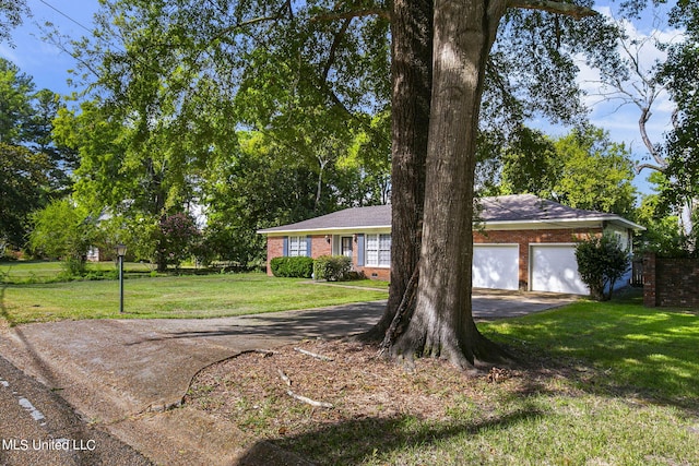 view of front of house with a garage and a front lawn