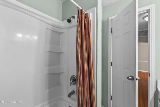 bathroom featuring shower / bath combo with shower curtain