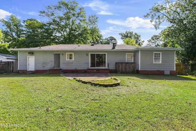 rear view of house with a lawn