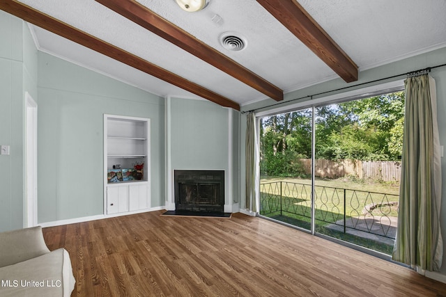 unfurnished living room featuring wood-type flooring, vaulted ceiling with beams, and built in features