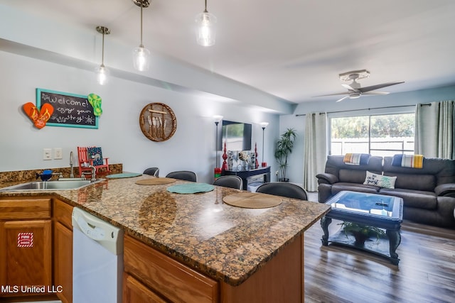 1664 Beach Blvd Unit 172, Biloxi, MS 39531 - kitchen with dishwasher, brown cabinetry, open floor plan, a peninsula, and ceiling fan