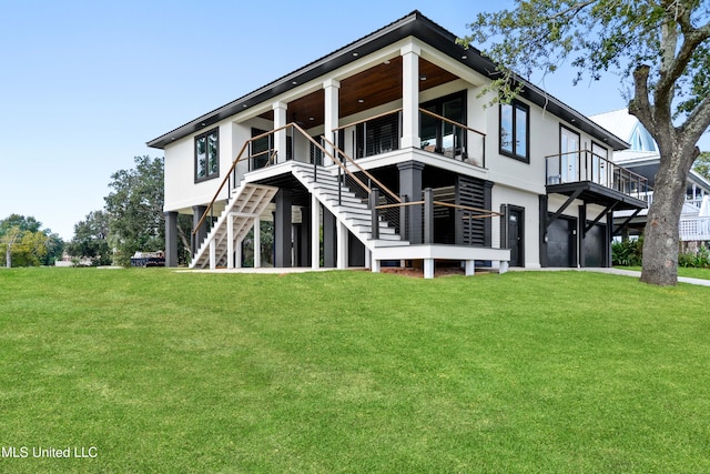 rear view of house with a lawn