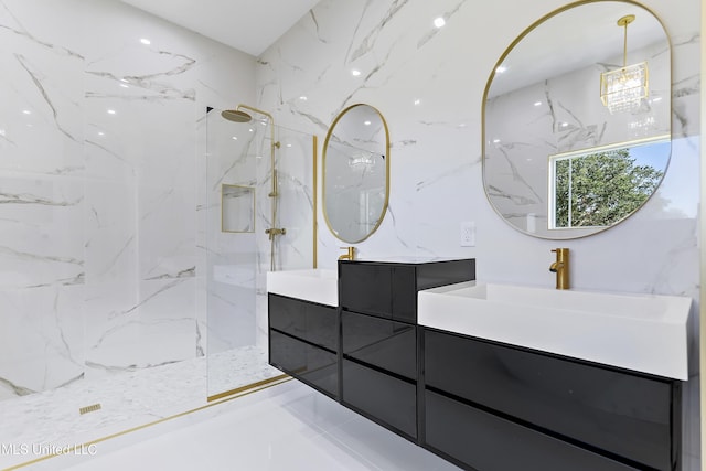 bathroom featuring tiled shower and vanity