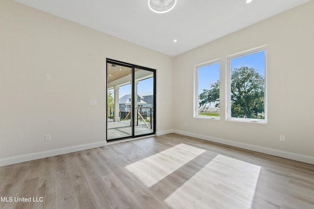 spare room with light wood-type flooring