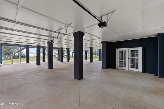 garage with french doors and a garage door opener