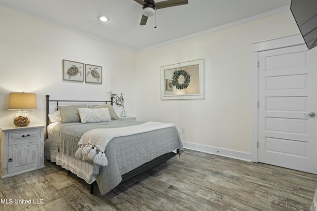 bedroom with crown molding, ceiling fan, baseboards, recessed lighting, and wood finished floors