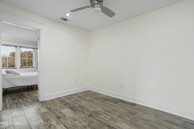 unfurnished room featuring visible vents, baseboards, recessed lighting, wood finished floors, and a ceiling fan