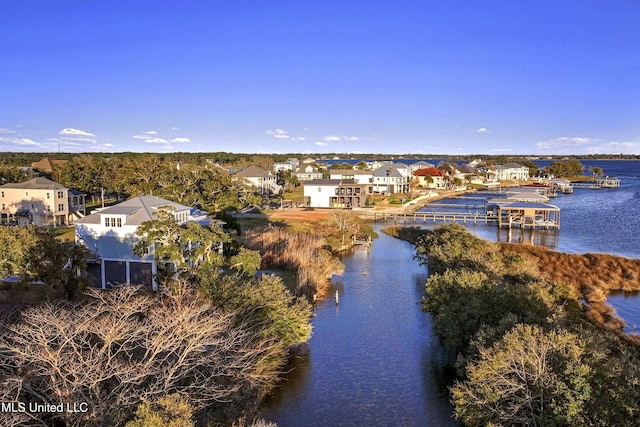 birds eye view of property with a residential view and a water view