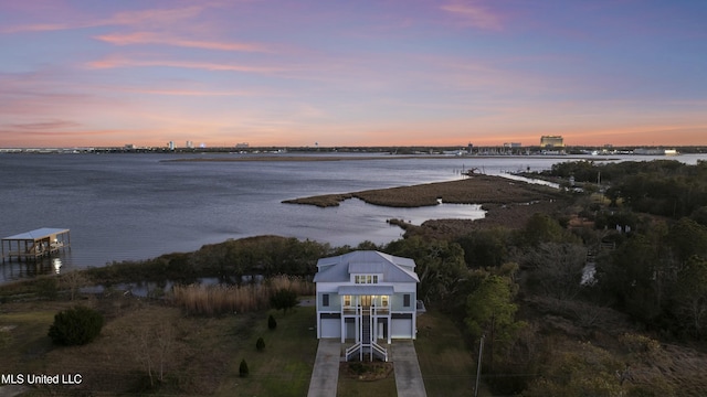 aerial view at dusk with a water view