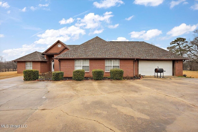 single story home with a garage