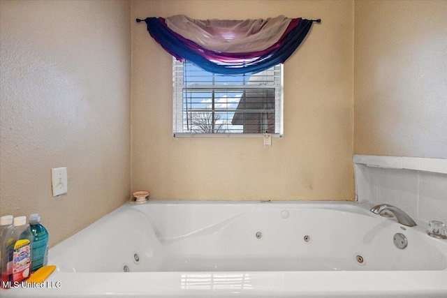 bathroom with a bathing tub