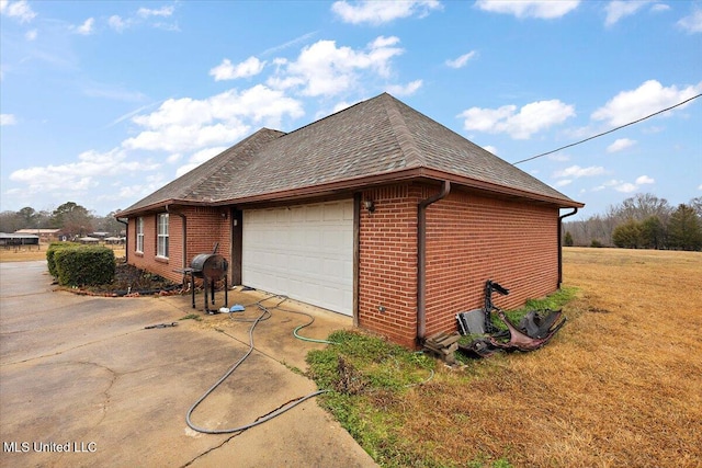 view of side of property with a lawn