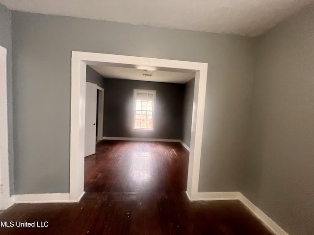 1289 S St, Grenada, MS 38901 - unfurnished room featuring wood finished floors and baseboards