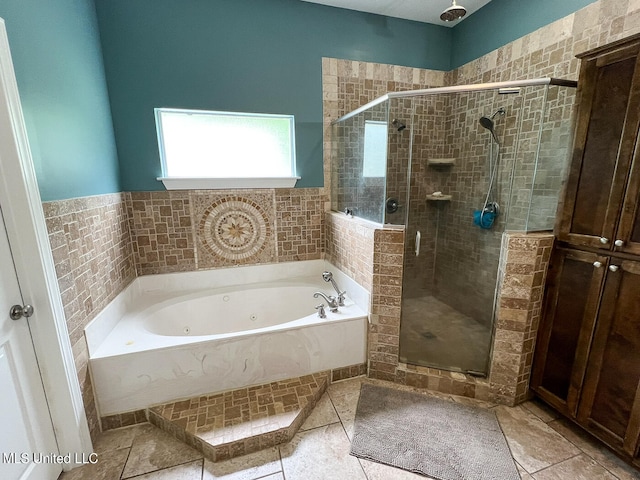 bathroom featuring tile patterned floors and shower with separate bathtub