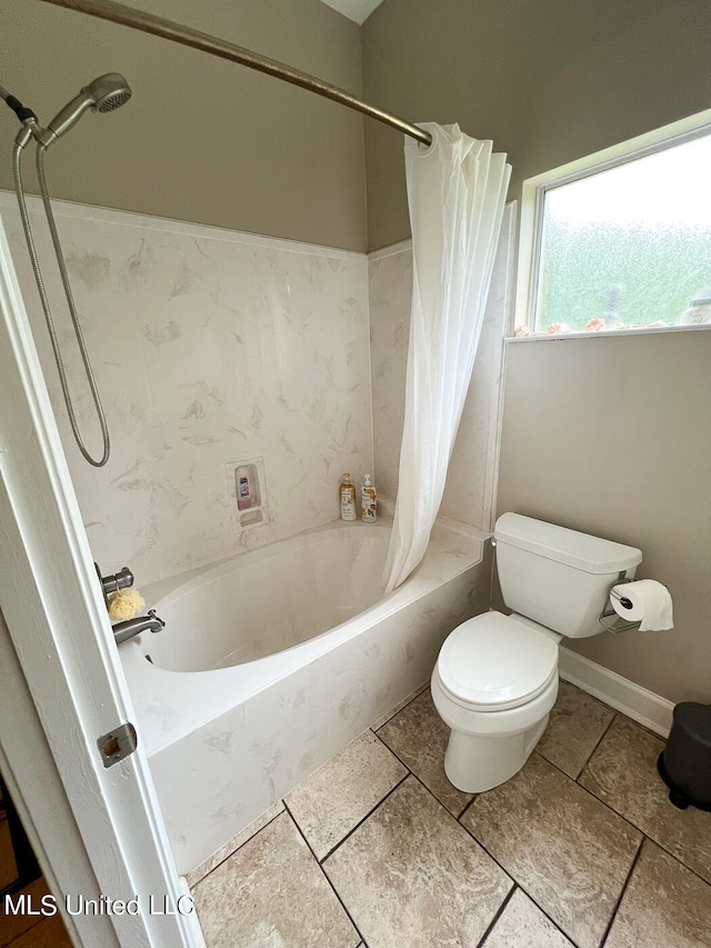 bathroom with shower / bath combination with curtain and toilet