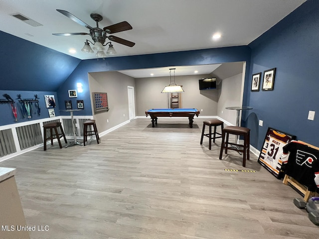 rec room with light hardwood / wood-style floors, bar, ceiling fan, lofted ceiling, and billiards