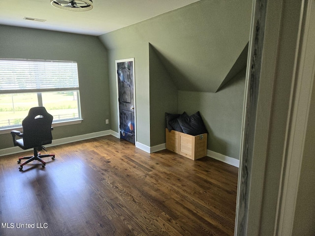 unfurnished office featuring vaulted ceiling and dark hardwood / wood-style floors